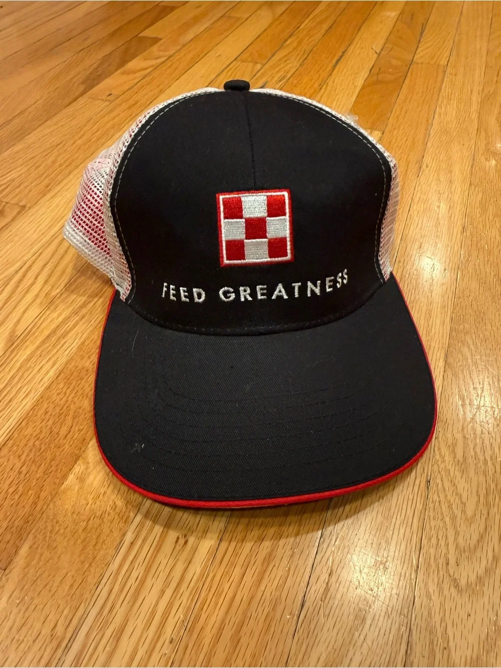 Feed Greatness Black & White Trucker Cap